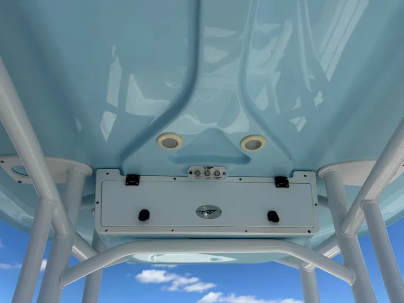 Slide: The Image of Tidewater 2300 Carolina Bay 2020 boat T-top with blue finish and storage compartment. - 34