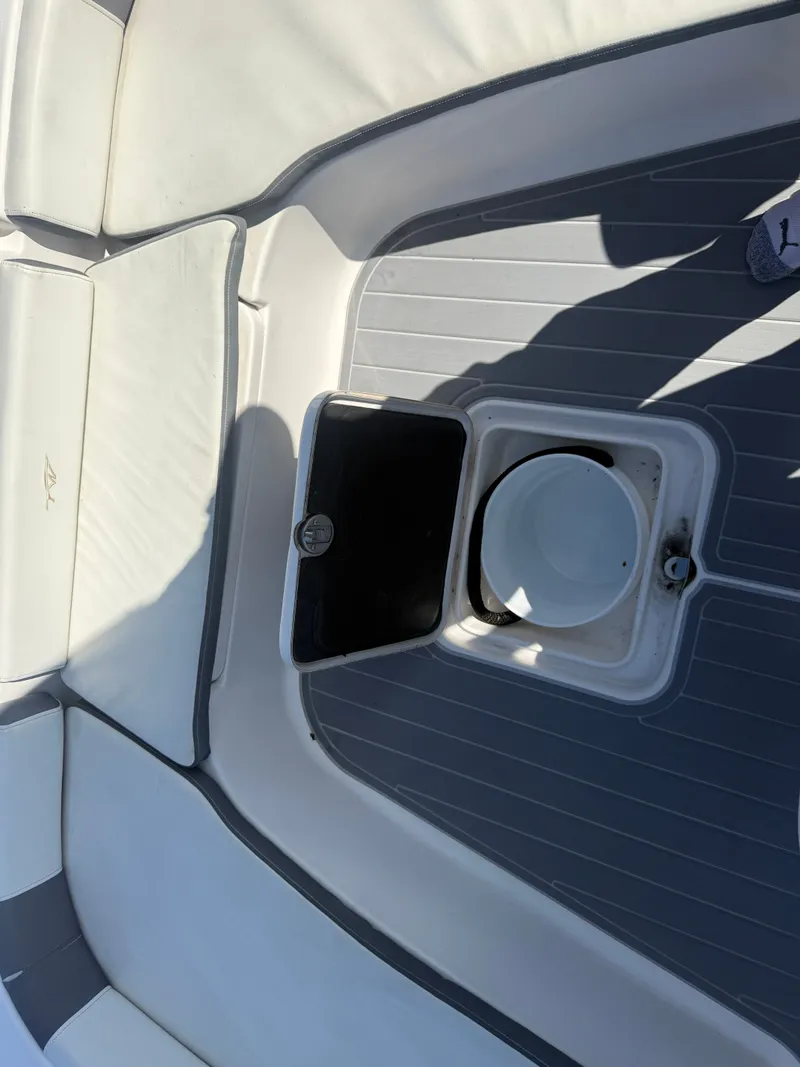 Slide: The Image of 2020 Tidewater 2300 Carolina Bay boat interior with seating and storage compartment. - 49