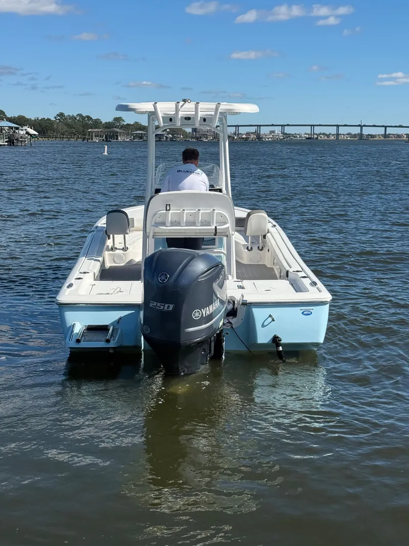 Slide: The Image of 2020 Tidewater 2300 Carolina Bay boat with Yamaha engine on calm water. - 6