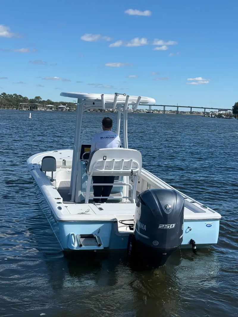 Slide: The Image of 2020 Tidewater 2300 Carolina Bay boat on water, rear view with Yamaha 250 engine. - 7