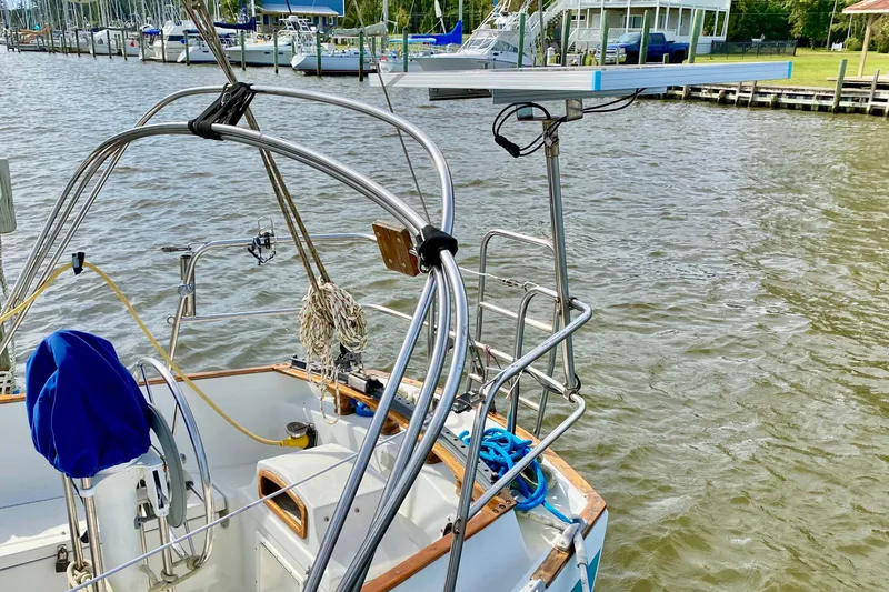 Slide: The Image of 1986 Bayfield 32 sailboat cockpit with marina background. - 15