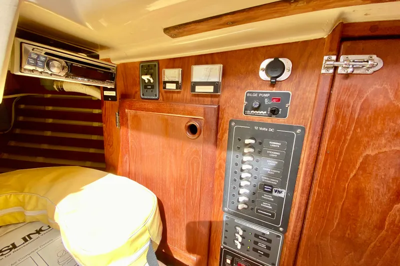 Slide: The Image of Control panel of a 1986 Bayfield 32 sailboat with switches and gauges. - 31