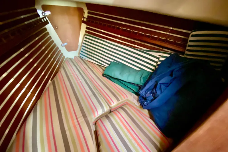 Slide: The Image of Cozy cabin interior of 1986 Bayfield 32 sailboat with striped cushions. - 39