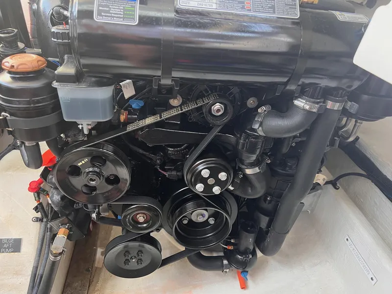 Slide: The Image of Engine of 2019 Cruisers Yachts 338 Bow Rider, showcasing belts and components. - 48