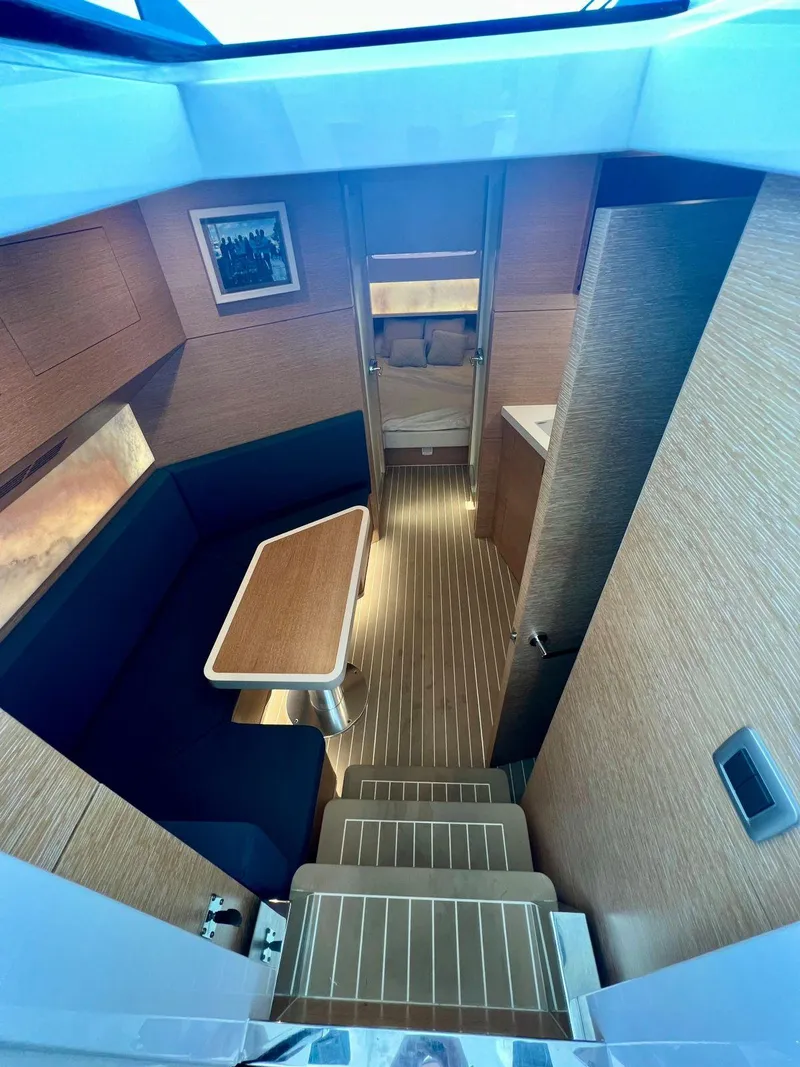 Slide: The Image of Luxurious interior of 2021 Scout 530 LXF yacht with modern wood finishes and seating area. - 15