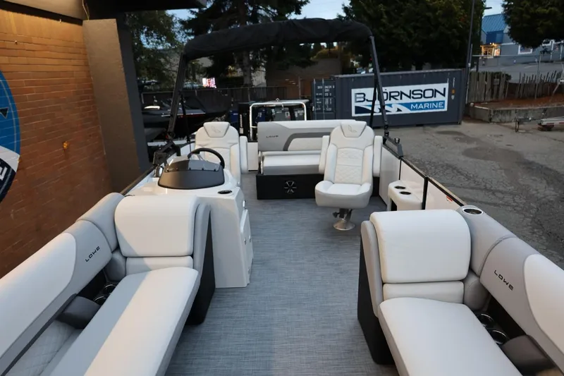 Slide: The Image of 2026 Lowe SS 230 CL pontoon boat with spacious seating and modern design. - 15