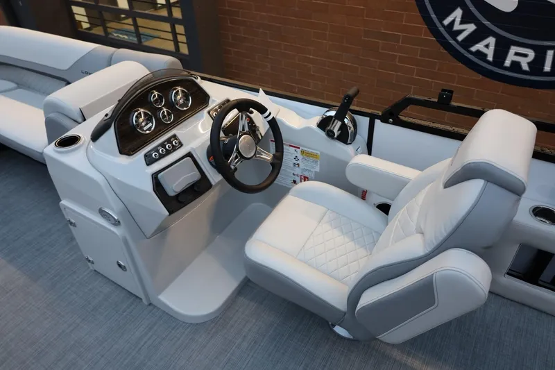 Slide: The Image of 2026 Lowe SS 230 CL boat interior with modern steering console and luxurious seating. - 23