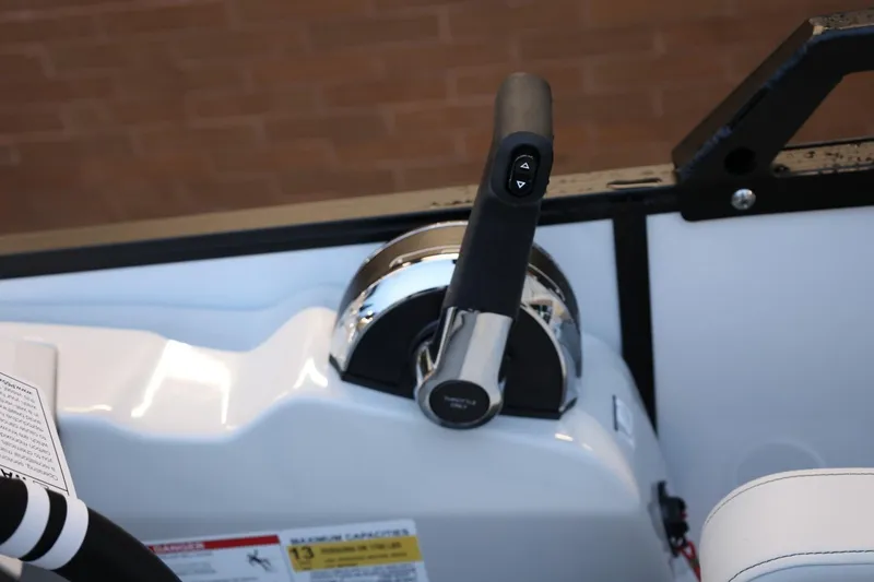 Slide: The Image of Throttle control of 2026 Lowe SS 230 CL boat, featuring sleek design and ergonomic handle. - 26