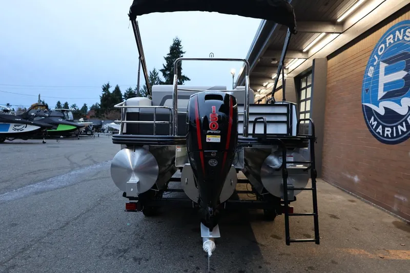 Slide: The Image of 2026 Lowe SS 230 CL pontoon boat with 150 HP engine at marina. - 5