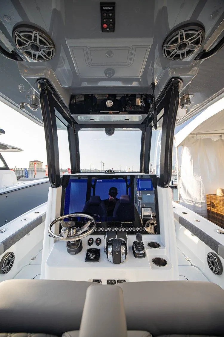 Slide: The Image of 2024 Freeman 28 boat cockpit with modern controls and navigation system. - 4