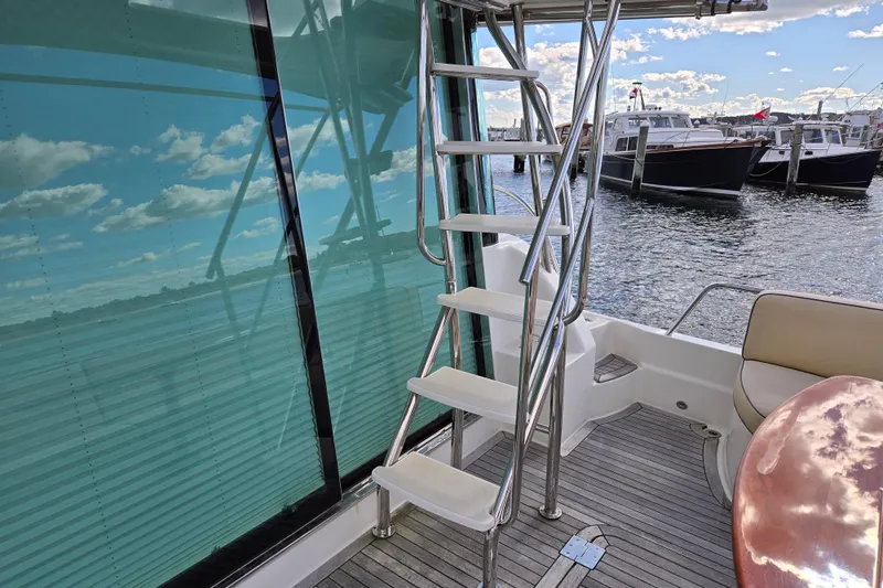 Slide: The Image of 2017 Sabre 48 Fly Bridge yacht anchor system with polished metal and ropes. - 12