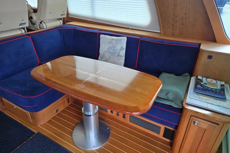 Slide: The Image of Flybridge seating area on 2017 Sabre 48 Fly Bridge yacht, covered in beige fabric. - 23