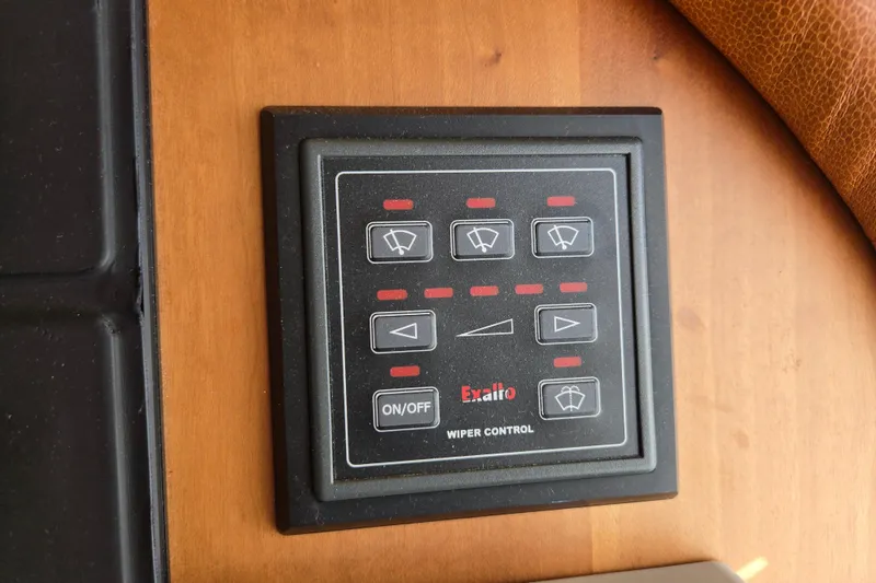 Slide: The Image of Throttle controls on 2017 Sabre 48 Fly Bridge yacht with Garmin navigation system. - 42