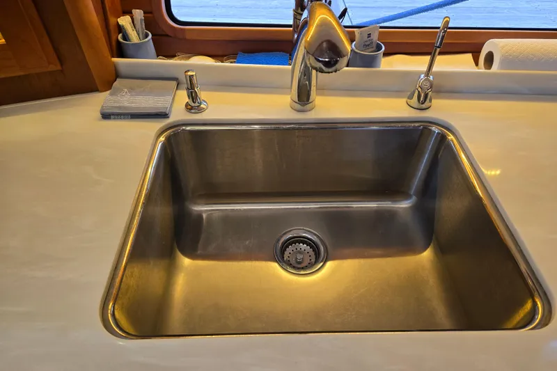 Slide: The Image of Stainless steel fridge in 2017 Sabre 48 Fly Bridge yacht interior. - 51