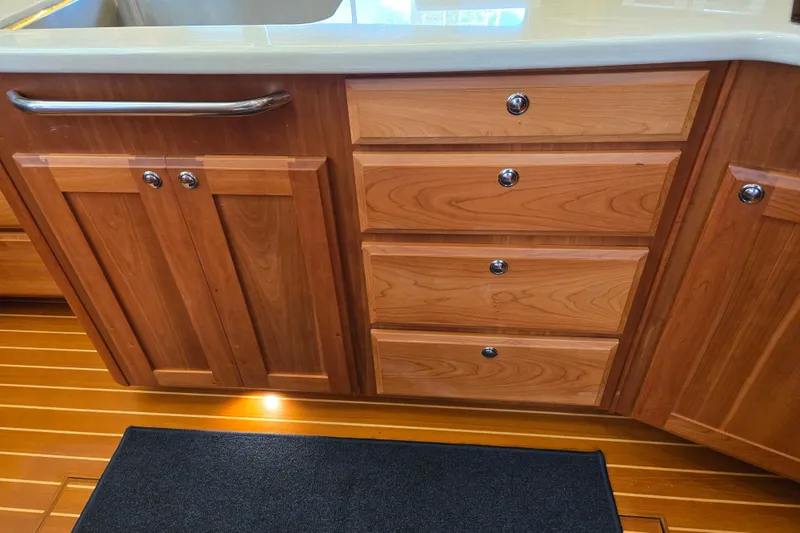 Slide: The Image of Wooden cabinet with glass doors on a 2017 Sabre 48 Fly Bridge yacht. - 56