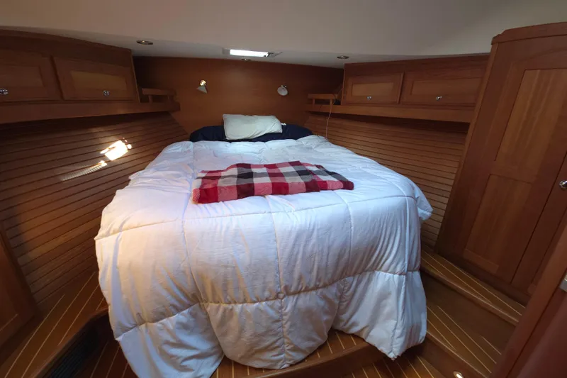 Slide: The Image of Luxurious bathroom sink in 2017 Sabre 48 Fly Bridge yacht with elegant wood cabinetry. - 64