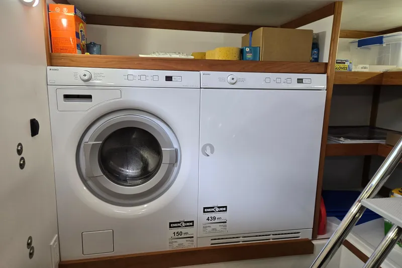 Slide: The Image of Wall-mounted TV in wooden interior of 2017 Sabre 48 Fly Bridge yacht. - 69