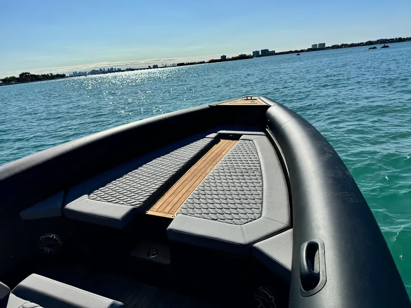 Slide: The Image of Skipper-BSK 34 boat (2025) on calm blue water, featuring sleek design and comfortable seating. - 10