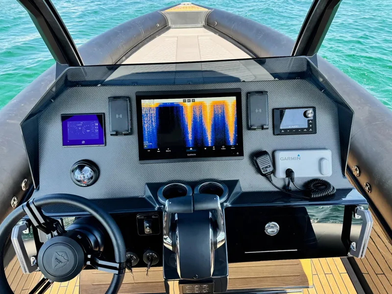 Slide: The Image of Cockpit of 2025 Skipper-BSK 34 boat with advanced navigation systems and steering wheel. - 30