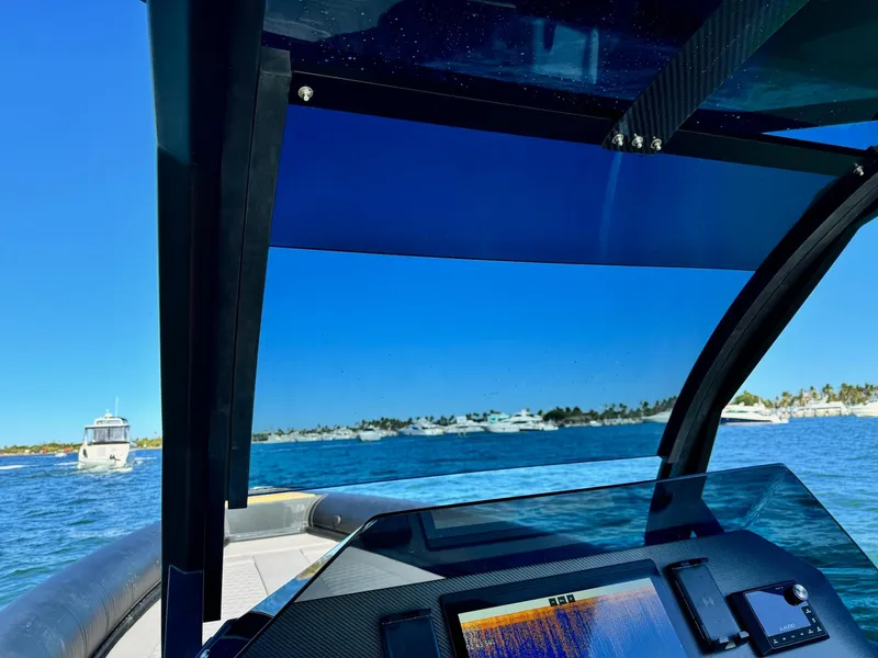 Slide: The Image of Skipper-BSK 34 boat dashboard view, cruising on a sunny day, 2025 model. - 32