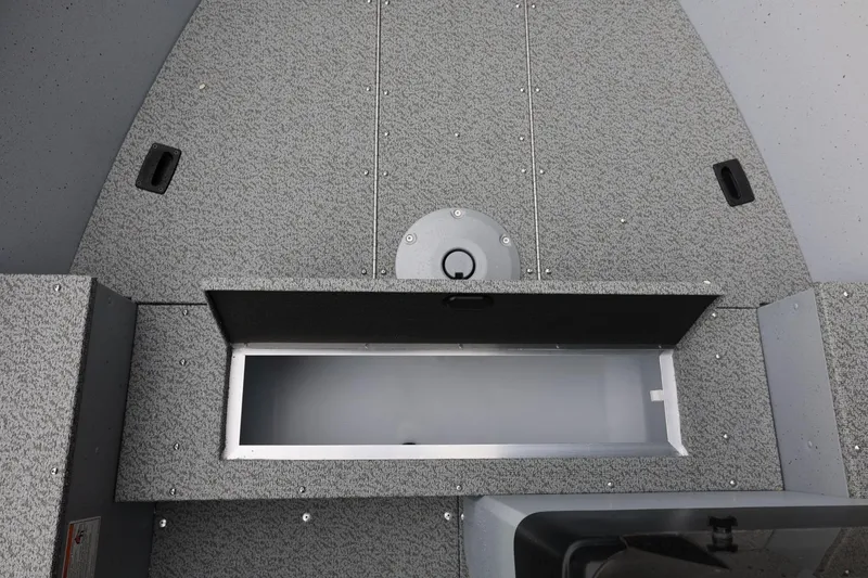 Slide: The Image of 2026 Lund 1400 Fury SS boat interior storage compartment, featuring a sleek, textured design. - 27