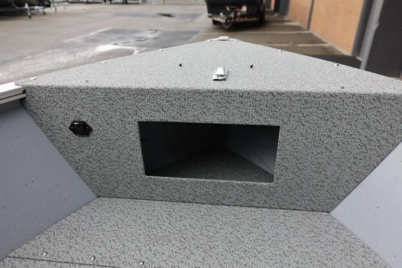 Slide: The Image of 2026 Lund 1400 Fury SS boat interior with storage compartment, gray textured finish. - 30