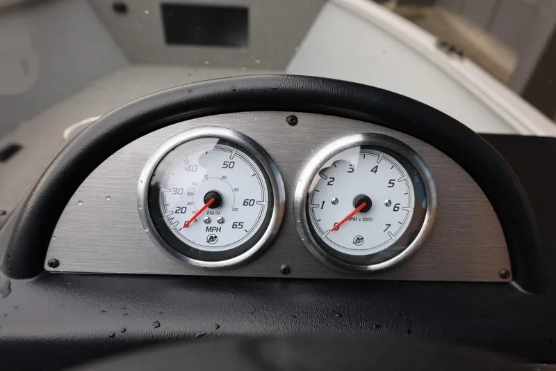 Slide: The Image of Dashboard of 2026 Lund 1400 Fury SS boat with speedometer and tachometer. - 33