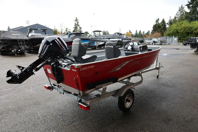 Slide: The Image of 2026 Lund 1400 Fury SS boat with Mercury outboard motor on a trailer. - 8