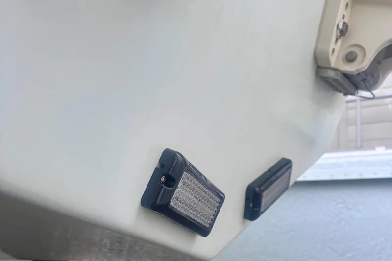 Slide: The Image of Rear view of a 2015 Dusky 278 boat showing trim tab and hydraulic system. - 10