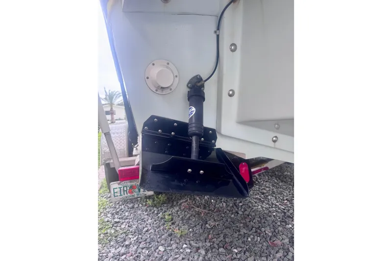 Slide: The Image of Close-up of Dusky 278 boat engine mount, showcasing bolts and wiring, 2015 model. - 11