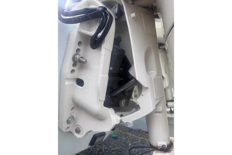 Slide: The Image of Twin Suzuki 175 outboard motors on a 2015 Dusky 278 boat, with a metal ladder. - 12