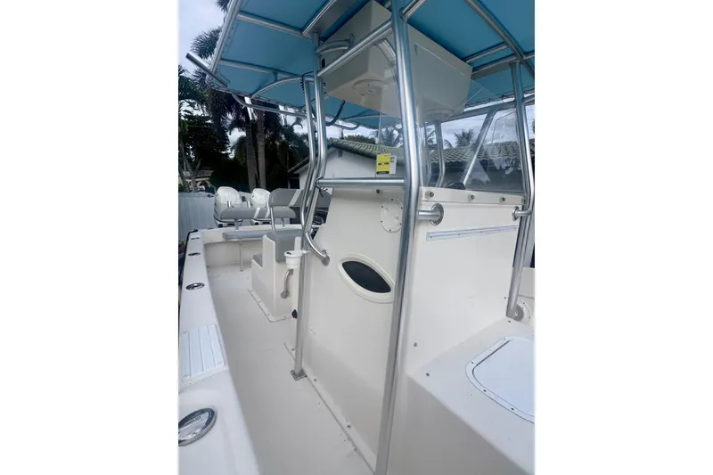Slide: The Image of 2015 Dusky 278 boat with blue canopy and stainless steel frame. - 25