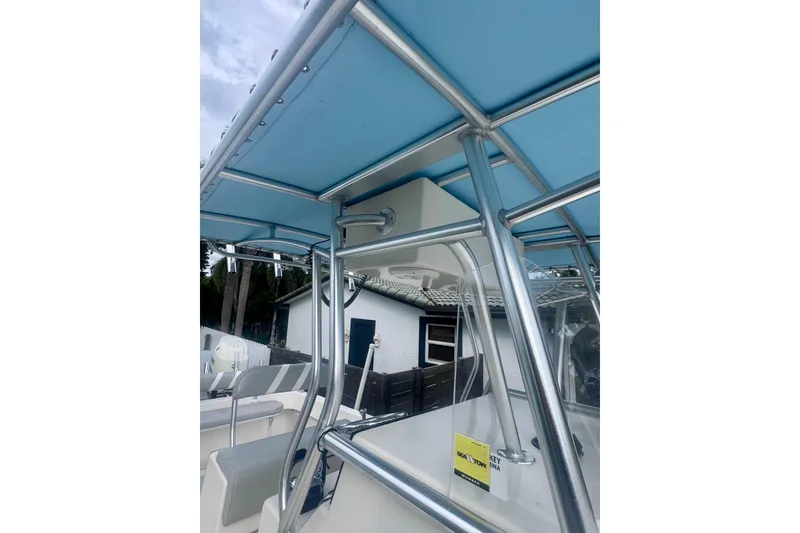 Slide: The Image of 2015 Dusky 278 boat helm with dual displays and steering wheel. - 26