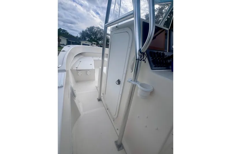 Slide: The Image of Interior view of a 2015 Dusky 278 boat showing electrical wiring and battery setup. - 29