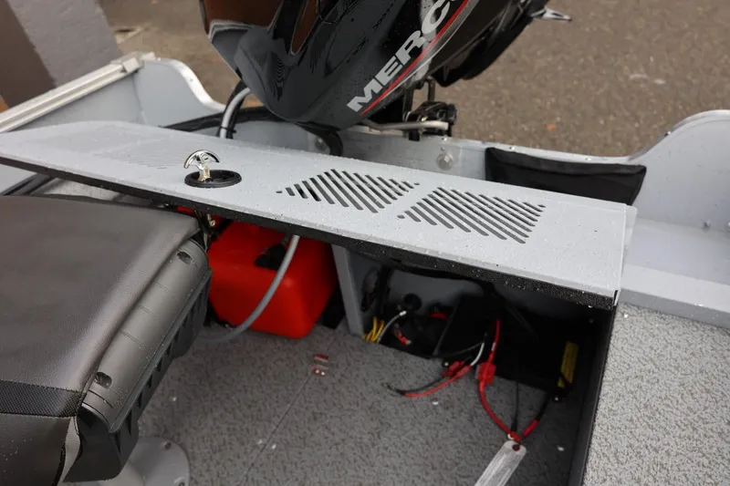Slide: The Image of 2026 Lund 1600 Fury SS boat interior with motor and seating details. - 23