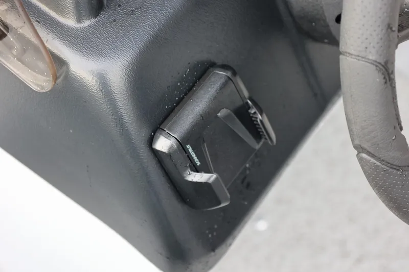 Slide: The Image of Close-up of 2026 Lund 1600 Fury SS boat steering wheel and control panel. - 27