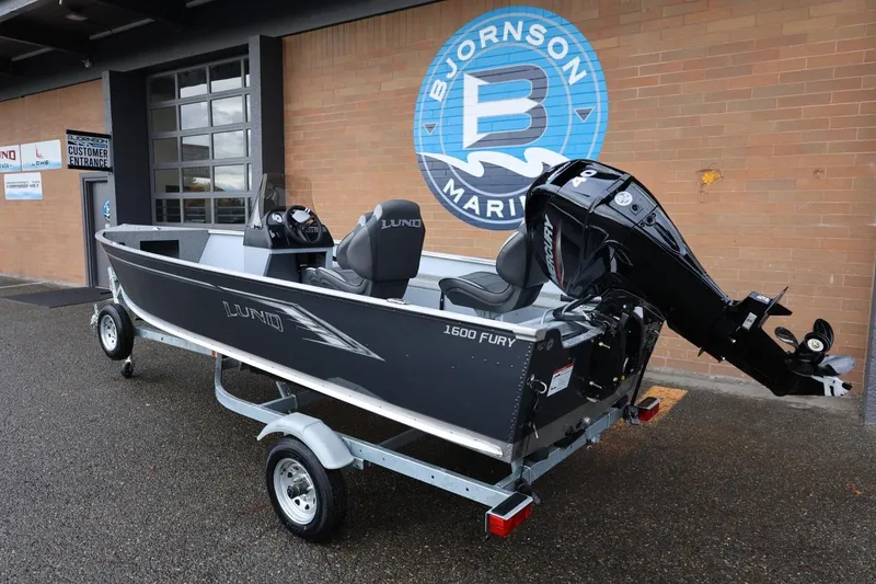 Slide: The Image of 2026 Lund 1600 Fury SS boat on trailer at Bjornson Marine dealership. - 3