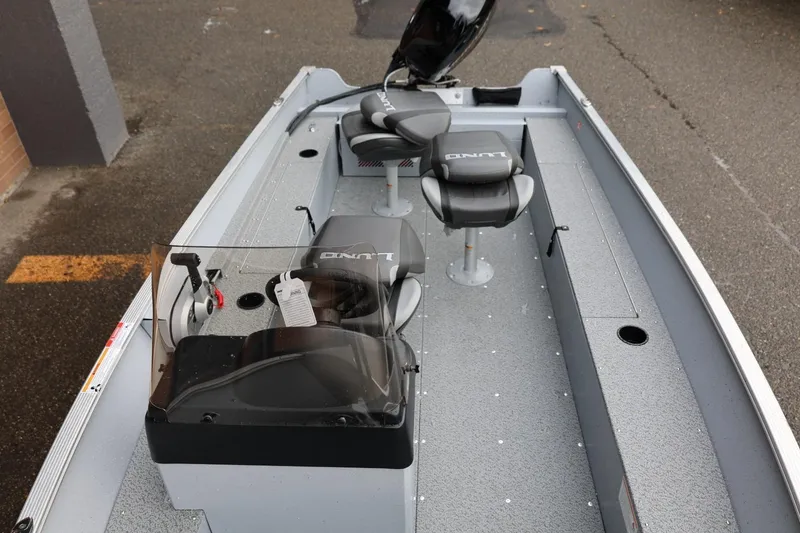 Slide: The Image of 2026 Lund 1600 Fury SS fishing boat interior with seating and console. - 32