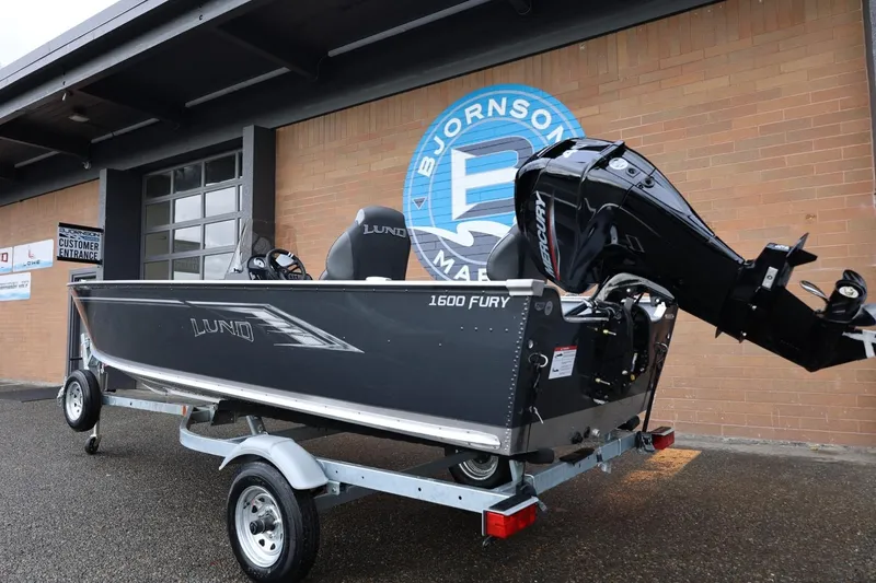 Slide: The Image of 2026 Lund 1600 Fury SS boat on trailer outside Bjornson Marine. - 4