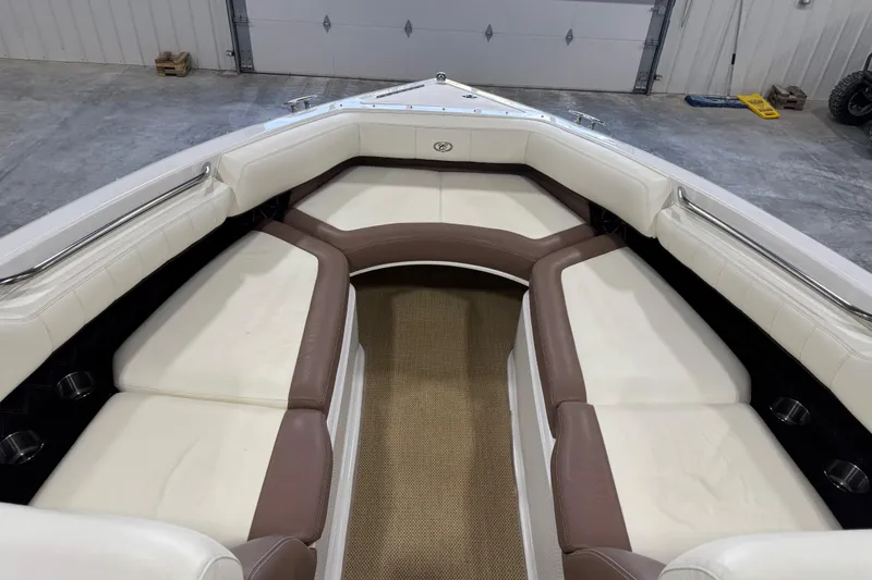 Slide: The Image of Interior of a 2012 Cobalt 276 boat with white and brown seating. - 12