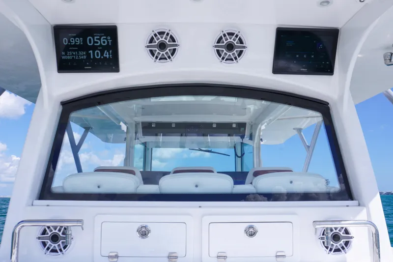 Slide: The Image of 2023 HCB 53 Sueños boat interior with modern dashboard and seating. - 21