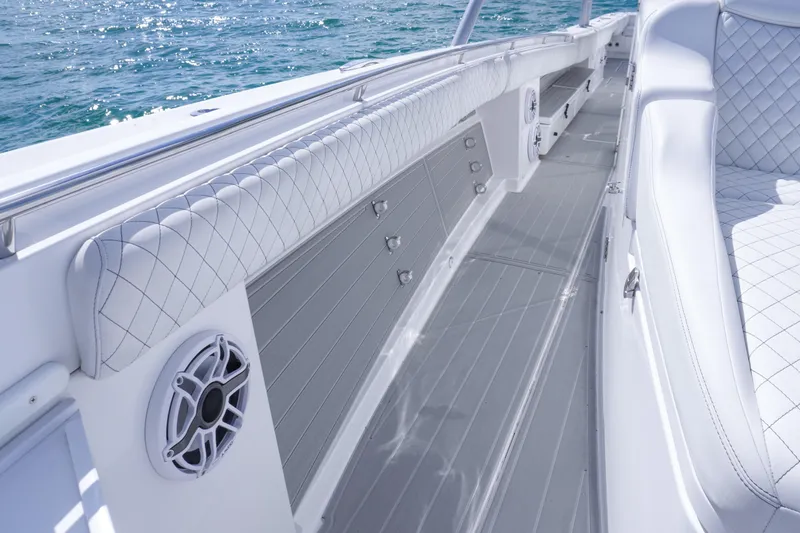 Slide: The Image of 2023 HCB 53 Sueños boat interior with luxurious seating and ocean view. - 25