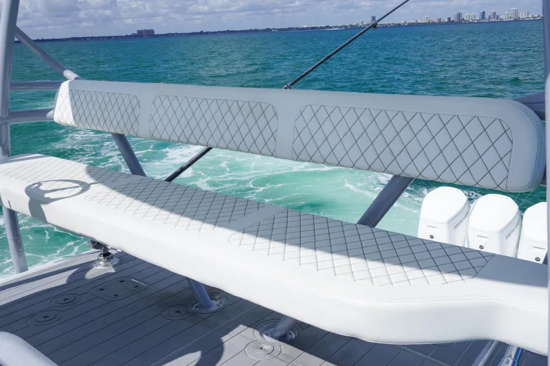 Slide: The Image of 2023 HCB 53 Sueños luxury boat interior with seating and ocean view. - 36