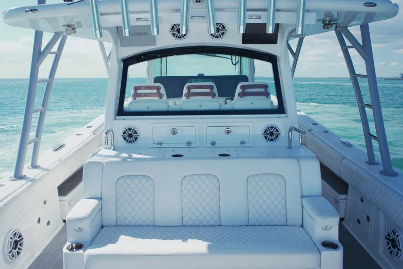 Slide: The Image of 2023 HCB 53 Sueños boat with multiple engines on open water. - 7