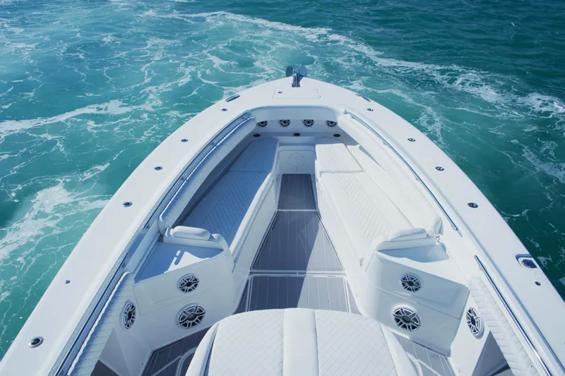 Slide: The Image of 2023 HCB 53 Sueños boat on clear blue water, aerial view. - 15