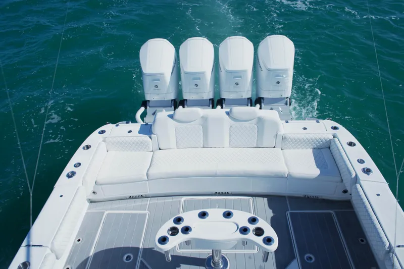 Slide: The Image of Luxury deck of 2023 HCB 53 Sueños boat with seating and cup holders. - 19