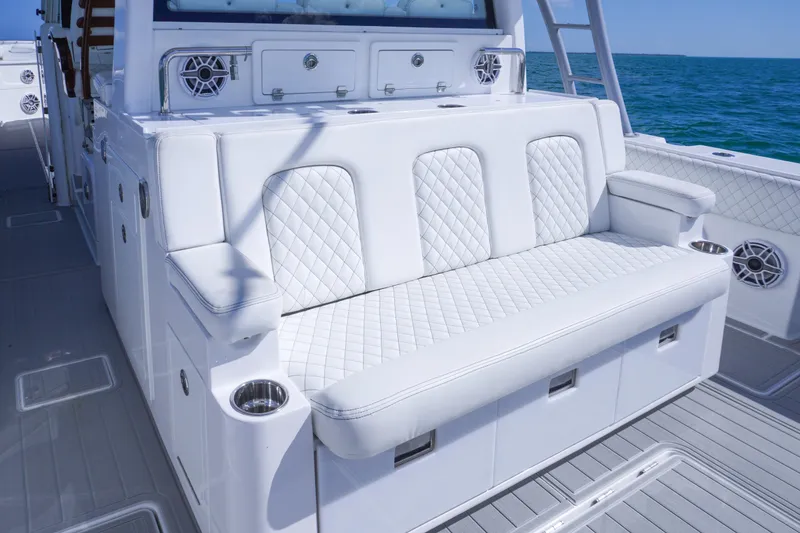 Slide: The Image of Luxurious seating on 2023 HCB 53 Sueños boat with quilted white upholstery. - 20