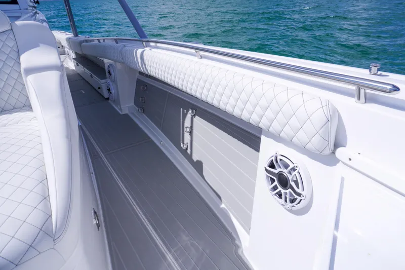 Slide: The Image of Luxury seating on 2023 HCB 53 Sueños boat with ocean and city skyline view. - 26