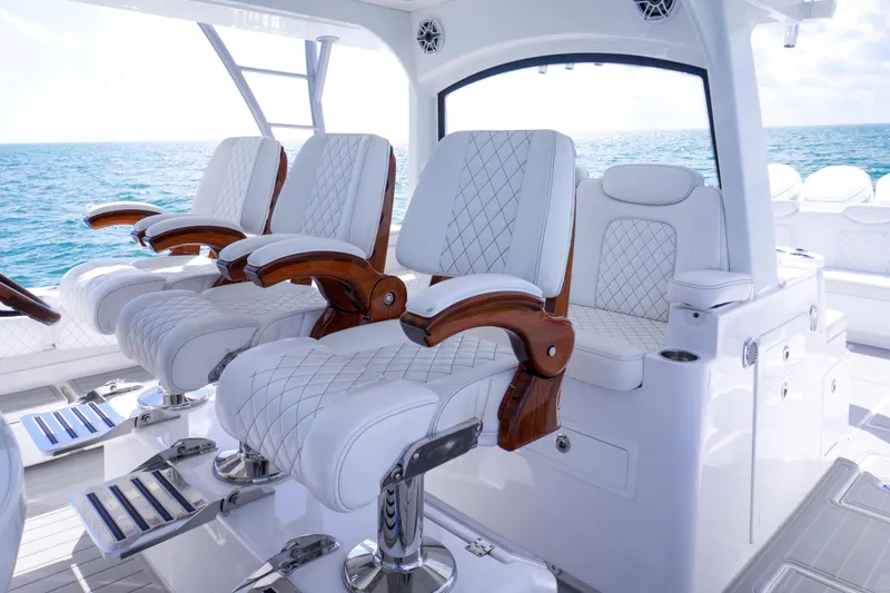 Slide: The Image of Luxurious interior of 2023 HCB 53 Sueños boat with quilted seating and ocean view. - 27