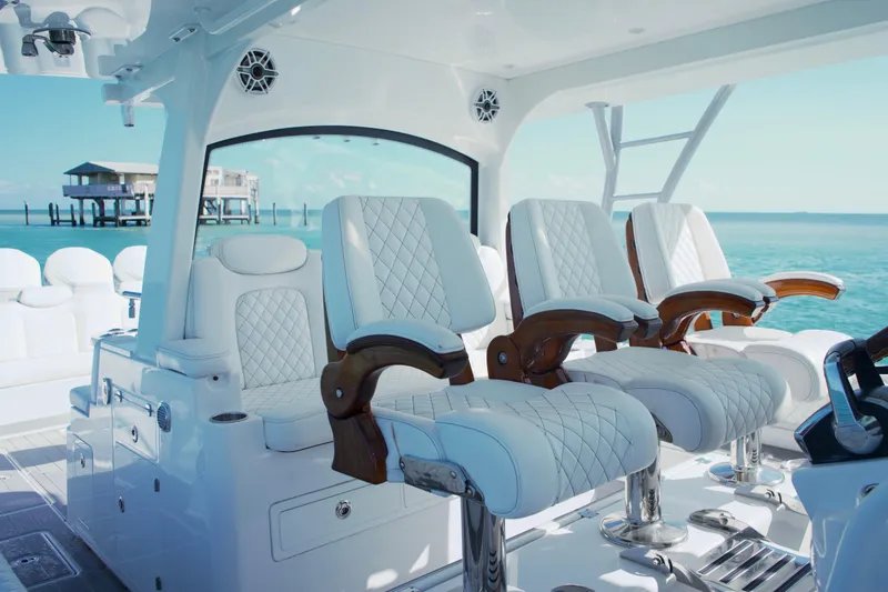 Slide: The Image of 2023 HCB 53 Sueños boat cruising on clear blue ocean waters. - 9